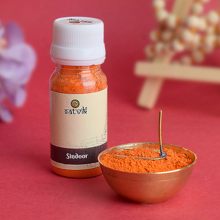 Sindoor powder for Hanuman Ji, bright orange-red in color, used in devotional offerings and rituals to honor and worship Lord Hanuman. 
India’s Largest Pooja Accessories Brand – www.satvikstore.in