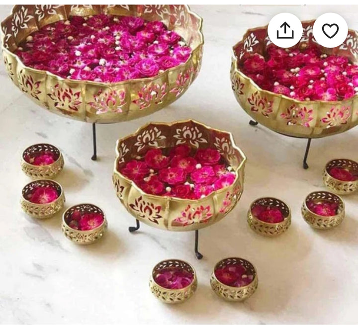 Striking Gold Lotus Diya Urli Set with 8 Votives – Elegant decorative urli set in a lotus design with gold finish, featuring 8 votive holders for festive and spiritual décor. India’s Largest Pooja Accessories Brand – www.satvikstore.in