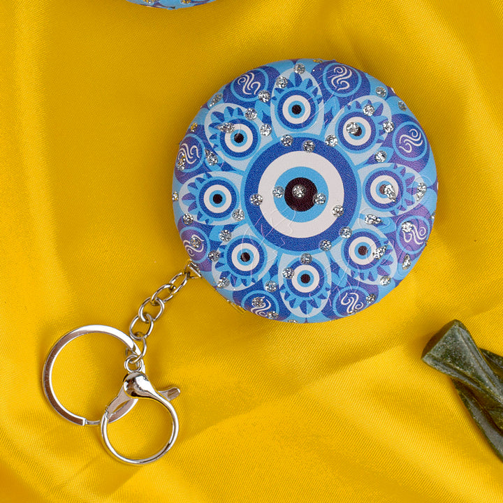 Stylish Round Evil Eye Keychain with Foldable Mirror β Practical and protective charm for everyday use. Indiaβs Largest Pooja Accessories Brand β www.satvikstore.in