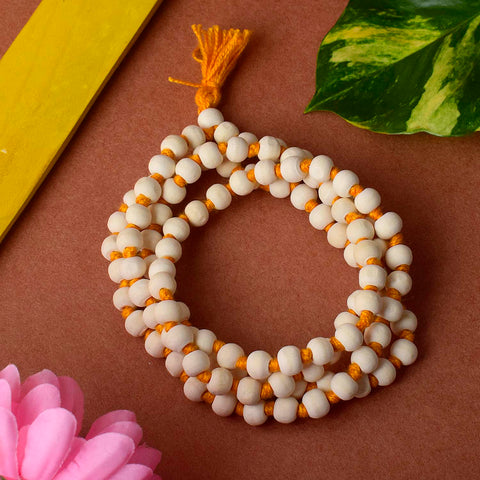 White Wooden Jaap Mala featuring smooth, light-colored beads strung together with a tassel, commonly used for meditation, mantra chanting, and spiritual practices. Indiaβs Premium Jap Mala Store- www.satvikstore.in