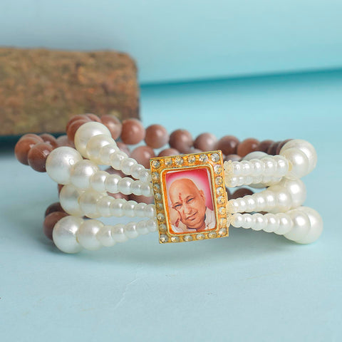Wine & White Pearl Four Layer Guruji Swaroop Bracelet featuring luxurious wine-colored beads and luminous white pearls with Jai Guruji Swaroop β perfect for spiritual wear, festive gifting, and daily devotion. Indiaβs Largest Pooja Accessories Brand β www.satvikstore.in