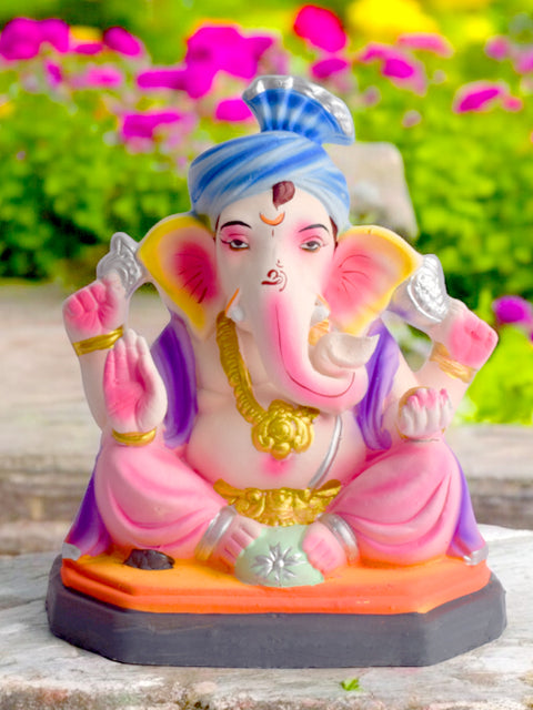 Vibrant 8-inch eco-friendly Ganesha idol in a relaxed sitting pose, beautifully handcrafted with colorful natural clay for Ganesh Chaturthi. Indiaβs Largest Pooja Accessories Brand β www.satvikstore.in
