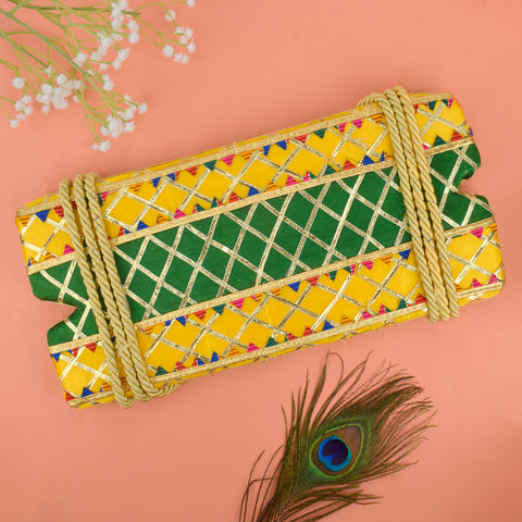 Bloom-themed yellow and green decorative Jhula for Hariyali Teej, designed for Lord Krishna idol with festive floral detailing. Indiaβs Largest Pooja Accessories Brand β www.satvikstore.in