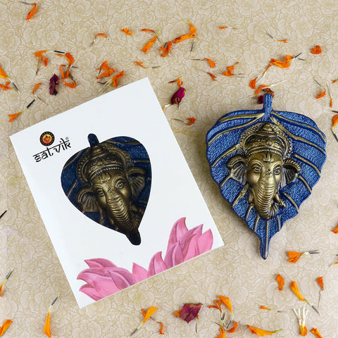 1 Pc Lord Ganesh Face on Leaf Patta Wall Hanging β Intricately designed wall decor featuring Lord Ganeshaβs face embossed on a green leaf-shaped patta for spiritual ambiance. Indiaβs Largest Pooja Accessories Brand β www.satvikstore.in