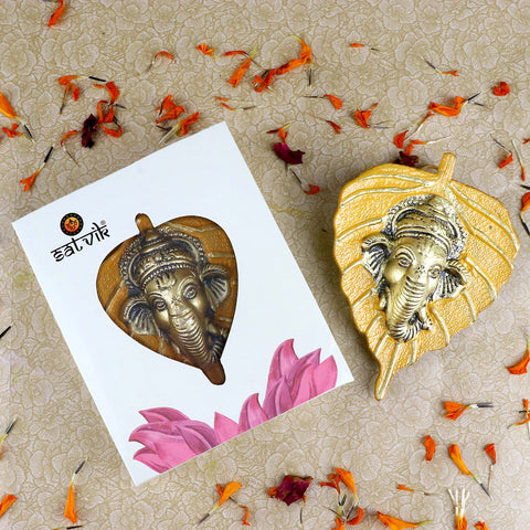 1 Pc Lord Ganesh Face on Leaf Patta Wall Hanging Yellow β Vibrant yellow leaf-shaped wall decor featuring Lord Ganeshaβs face for traditional and spiritual home decoration. Indiaβs Largest Pooja Accessories Brand β www.satvikstore.in