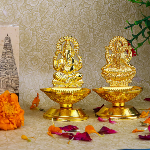 2 Pc Laxmi Ganesha Pair Metal Diya β A beautifully designed pair of metal diyas featuring Goddess Lakshmi and Lord Ganesha, ideal for spiritual rituals and enhancing home decor. Indiaβs Largest Pooja Accessories Brand β www.satvikstore.in