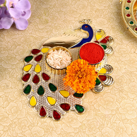 Alluring Peacock Roli Akshat Platter, beautifully designed with a peacock motif, perfect for holding roli and akshat during pooja, tilak, and festive ceremonies. 
Indiaβs Largest Pooja Accessories Brand β www.satvikstore.in