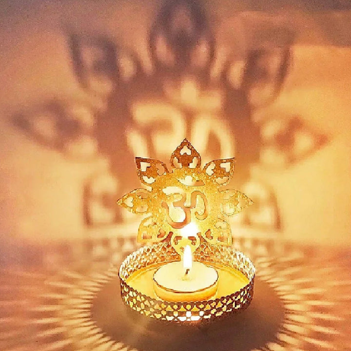 Decorative, alluring OM Shadow Diya made of metal, designed to cast a glowing OM symbol shadow when lit—perfect for meditation spaces, Diwali décor, and spiritual ambiance. India’s Largest Pooja Accessories Brand – www.satvikstore.in