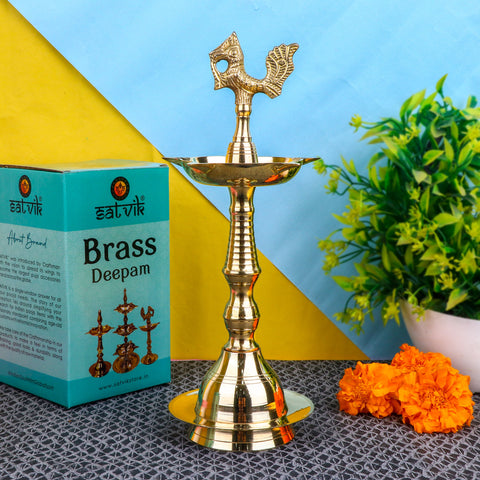 10 Inch Brass Peacock Kerala Diya – Handcrafted brass diya featuring a peacock motif, ideal for pooja rituals, temple lighting, and traditional décor. India’s Largest Pooja Accessories Brand – www.satvikstore.in
