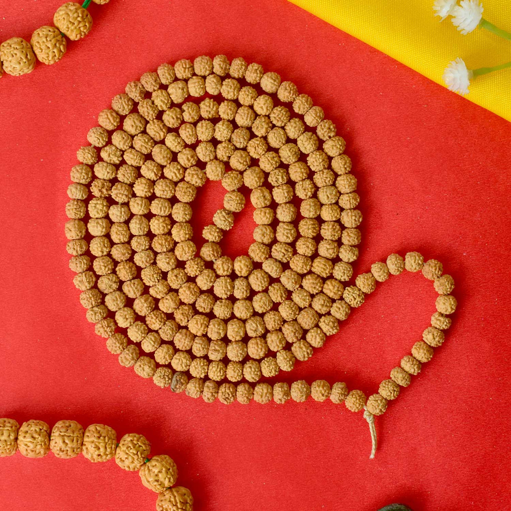 Semi Pathariya Rudraksha Mala with natural brown beads for meditation and spiritual chanting. India’s Premium Rudraksha Jap Mala Store- www.satvikstore.in
