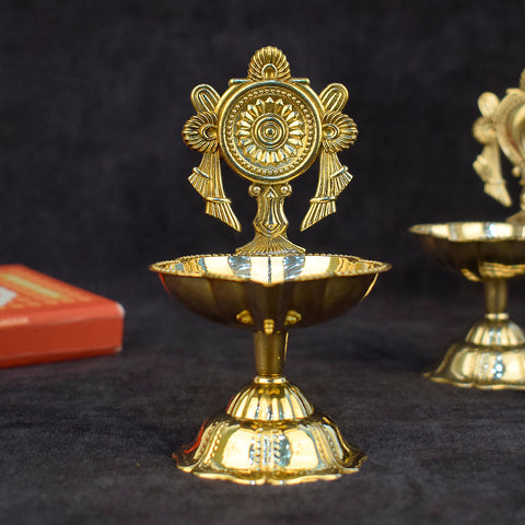 Elegant Designer Chakra Brass Diya – Beautifully crafted brass diya with intricate chakra design, ideal for temple rituals and spiritual décor. India’s Largest Pooja Accessories Brand – www.satvikstore.in