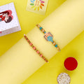 Elegant floral and pink beaded Bhaiya Rakhi Set of 2 India’s Largest Pooja Accessories Brand – www.satvikstore.in
