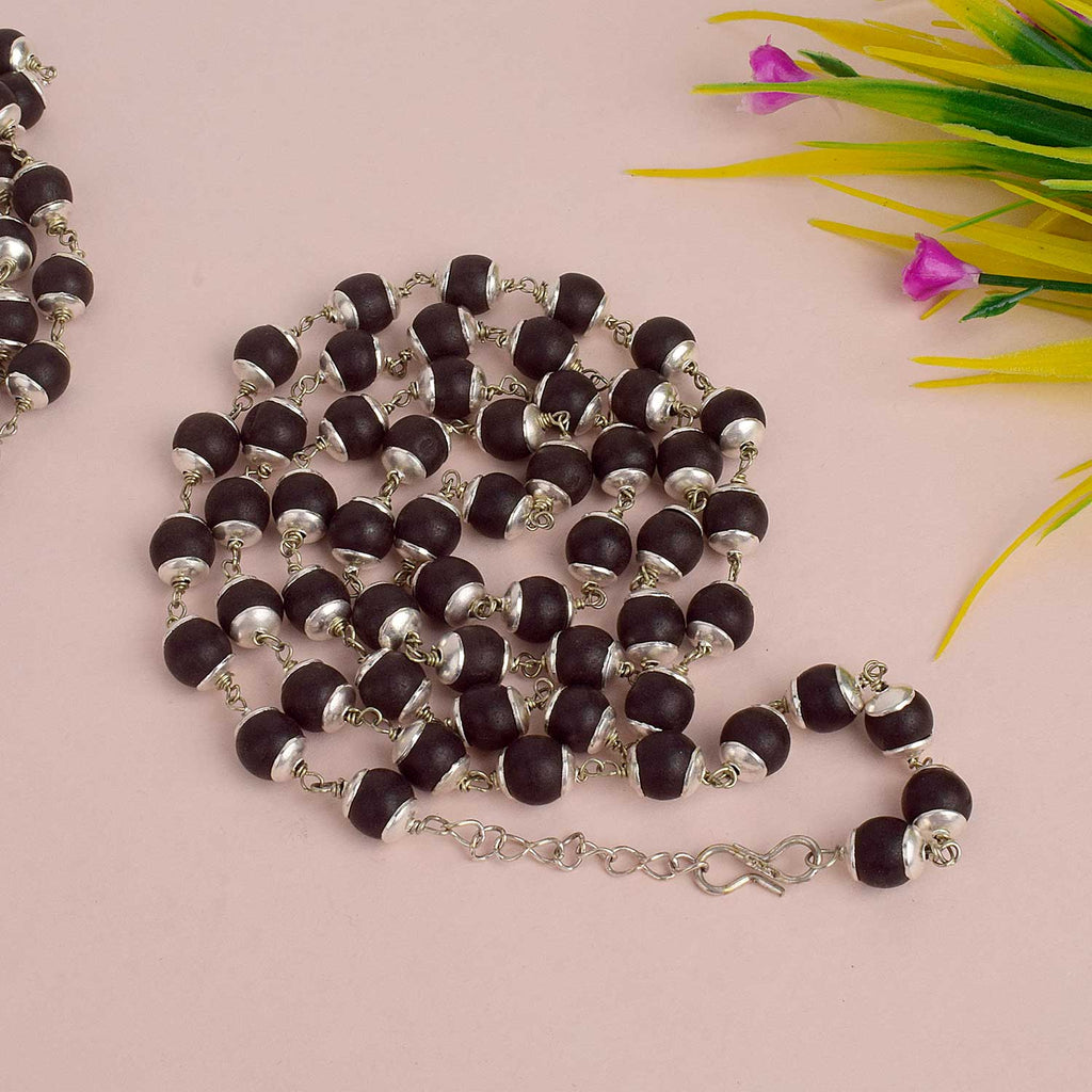 Karungli/Ebony Mala handcrafted from sacred ebony wood beads, available in two elegant variants—metal cap for daily wear and pure silver cap for premium spiritual practices, offering protection, grounding, and spiritual focus. India’s Largest Pooja Accessories Brand - www.satvikstore.in


