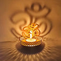 Handcrafted OM Shadow Diya, an intricately designed lamp showcasing the sacred OM symbol. When lit, it casts a divine shadow, perfect for spiritual rituals, meditation, or adding a touch of elegance to your home decor. India’s Largest Pooja Accessories Brand – www.satvikstore.in
